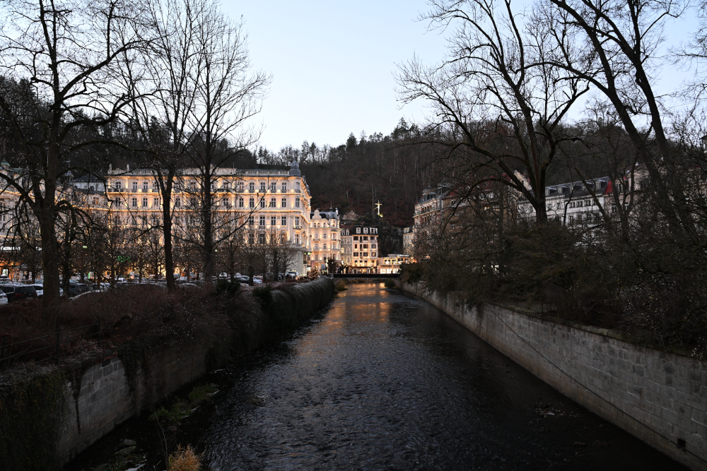 Grand Hotel Pupp from river side in Karlovy Vary in Christmass time